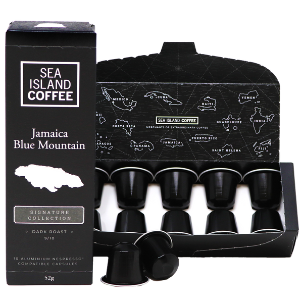 Product shot of some Jamaica Blue Mountain Nespresso compatible coffee pods in black dark roast capsules