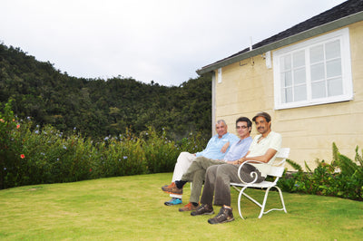 Owners of Clifton Mount estate sitting in the garden next to the Blue Mountains