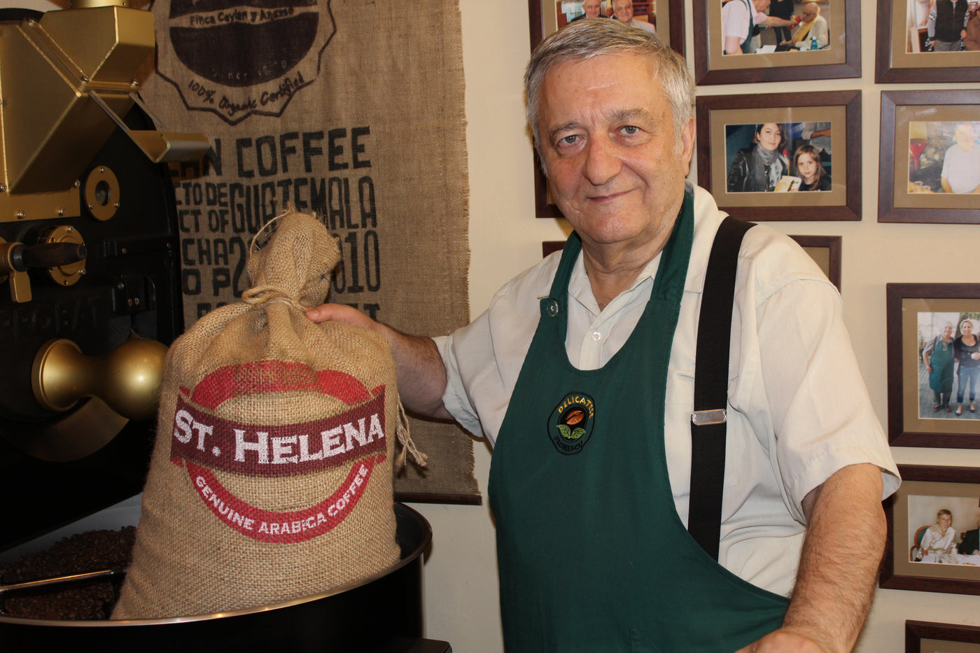 St Helena coffee farmer holding a bag of unroasted coffee beans